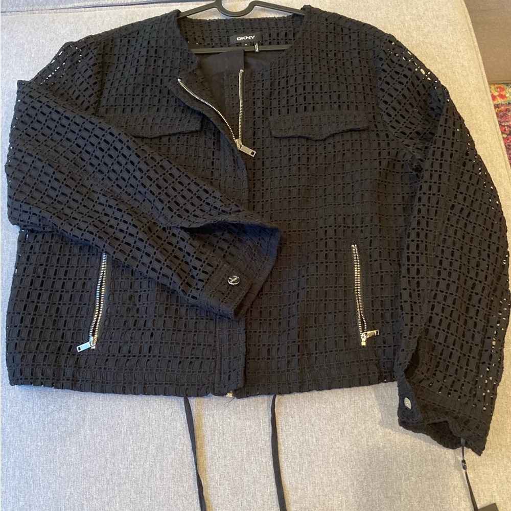 Black DKNY jacket with mesh type cutouts and zipper details. NWT! Never worn. XL